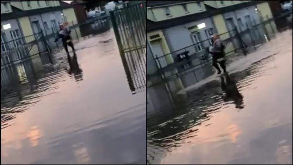 Strażak przeniósł kobietę przez wodę. Dostał w nagrodę buziaka [film]